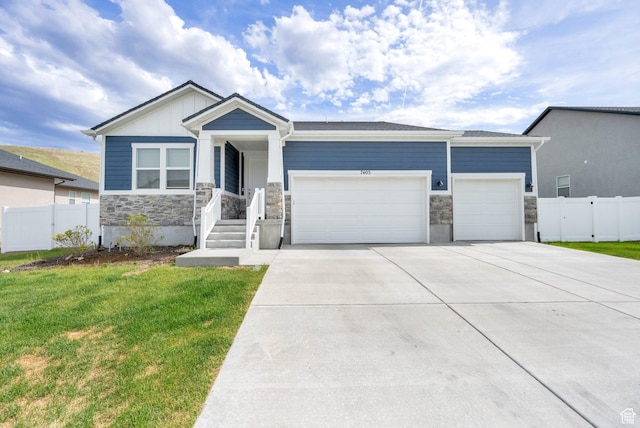 7405 W Glowing Sky Dr S, West Valley City, UT 84081 - view of front of property with stone siding, a garage, and concrete driveway