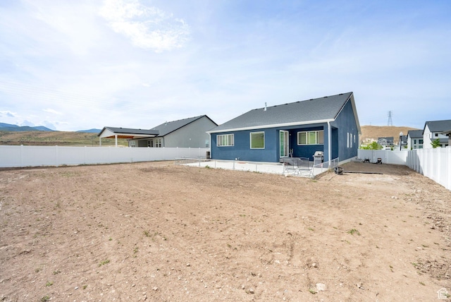 7405 W Glowing Sky Dr S, West Valley City, UT 84081 - view of front of house with a patio area and a fenced backyard