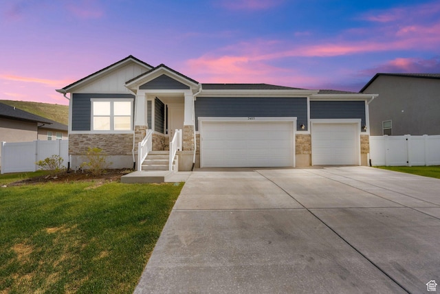 7405 W Glowing Sky Dr S, West Valley City, UT 84081 - ranch-style home featuring stone siding, a garage, and concrete driveway