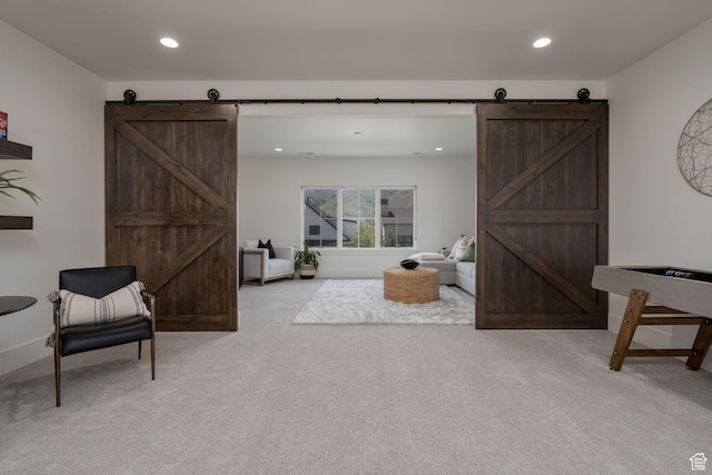 517 N Farm Hill Ln, Midway, UT 84049 - sitting room with a barn door, light colored carpet, recessed lighting, and baseboards