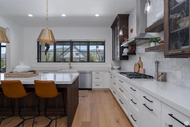 517 N Farm Hill Ln, Midway, UT 84049 - kitchen with stainless steel appliances, plenty of natural light, a kitchen breakfast bar, light countertops, and recessed lighting