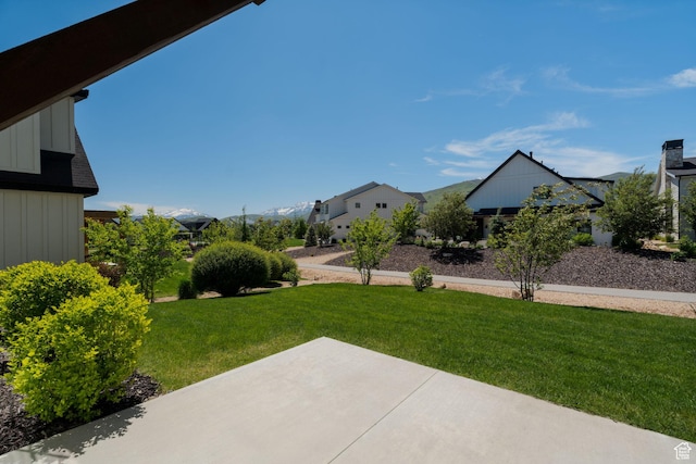 517 N Farm Hill Ln, Midway, UT 84049 - view of green lawn with a patio area and a residential view