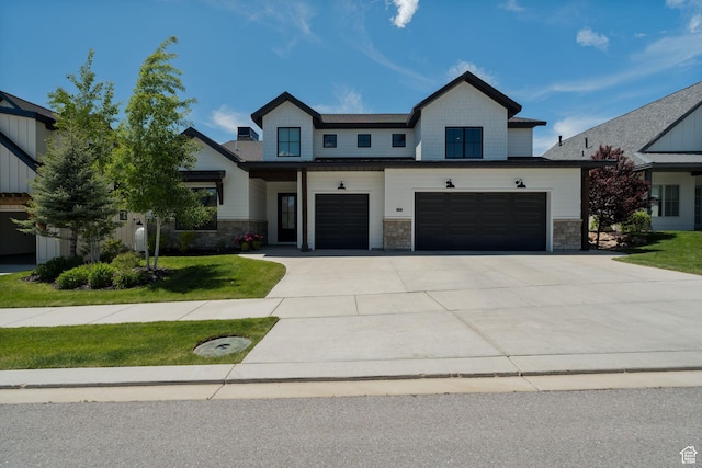 517 N Farm Hill Ln, Midway, UT 84049 - modern inspired farmhouse with concrete driveway, an attached garage, stone siding, and a front yard