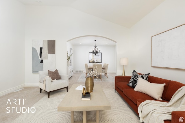2188 E Tuscany Creek Way S, Draper, UT 84020 - living area with arched walkways, a chandelier, light carpet, baseboards, and high vaulted ceiling