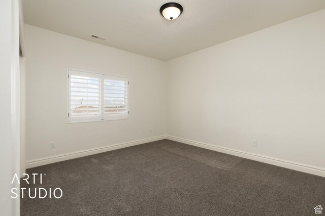 2188 E Tuscany Creek Way S, Draper, UT 84020 - empty room featuring dark carpet and baseboards