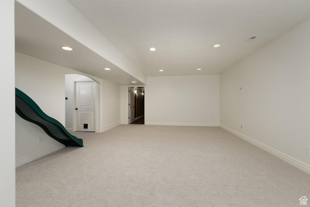 2188 E Tuscany Creek Way S, Draper, UT 84020 - below grade area with recessed lighting, light carpet, arched walkways, and baseboards