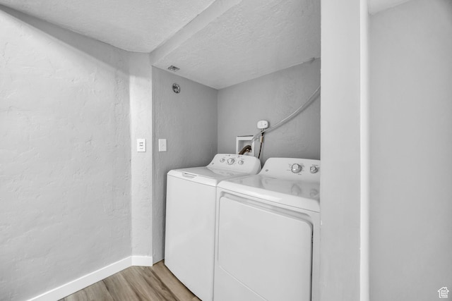 326 E 39th S, South Ogden, UT 84405 - laundry area with separate washer and dryer, light wood-style flooring, baseboards, a textured ceiling, and a textured wall