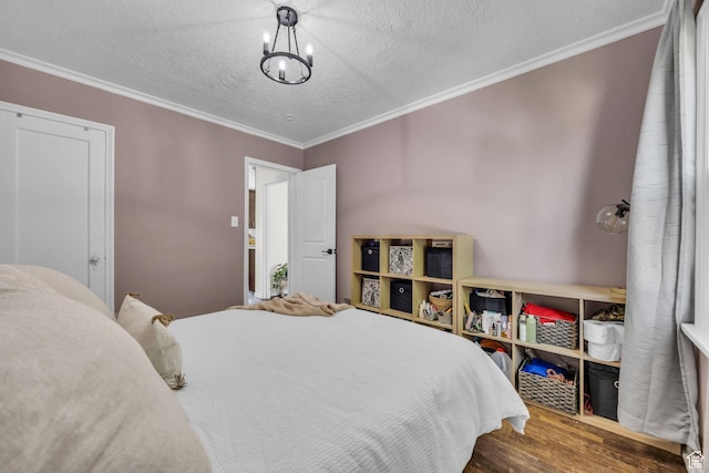 326 E 39th S, South Ogden, UT 84405 - bedroom with wood finished floors, crown molding, a textured ceiling, and a chandelier