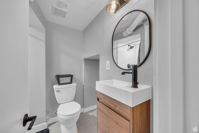 326 E 39th S, South Ogden, UT 84405 - bathroom with toilet, vanity, and baseboards
