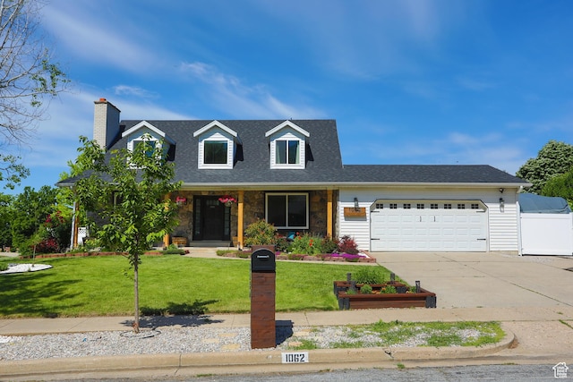 1062 Creek View Dr, Fruit Heights, UT 84037 - cape cod home featuring an attached garage, a front lawn, concrete driveway, and a chimney