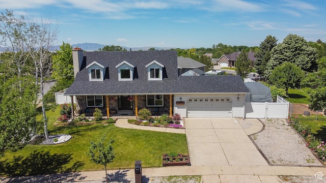 1062 Creek View Dr, Fruit Heights, UT 84037 - cape cod-style house with an attached garage, covered porch, a gate, driveway, and roof with shingles