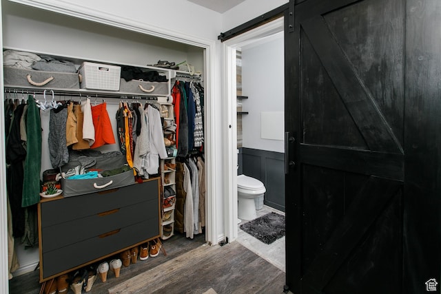 1062 Creek View Dr, Fruit Heights, UT 84037 - bathroom featuring wood finished floors, toilet, a walk in closet, and wainscoting