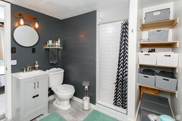 1062 Creek View Dr, Fruit Heights, UT 84037 - full bath with tiled shower, toilet, vanity, baseboards, and a textured ceiling