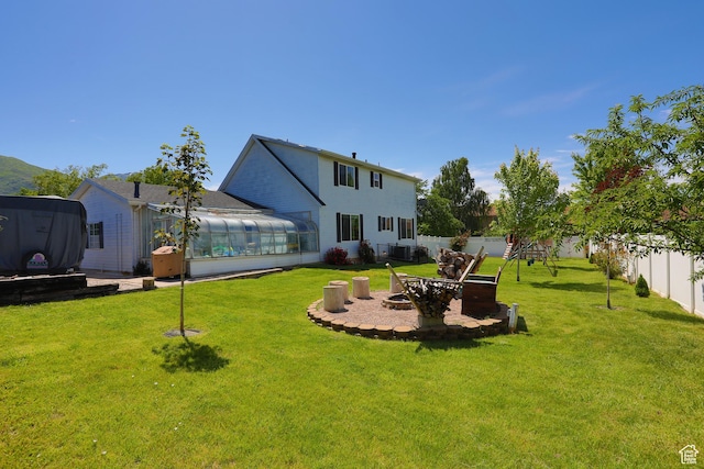 1062 Creek View Dr, Fruit Heights, UT 84037 - back of property featuring a sunroom and an outdoor fire pit