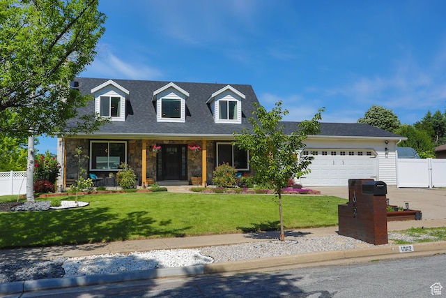 1062 Creek View Dr, Fruit Heights, UT 84037 - cape cod-style house featuring an attached garage, driveway, a porch, stone siding, and a shingled roof