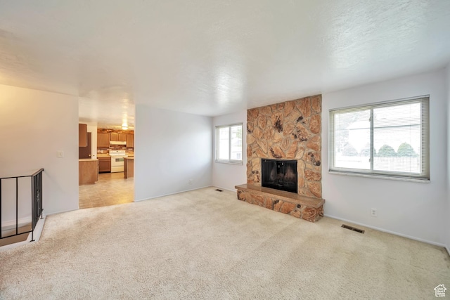5373 S Clover Meadow Dr W, Murray, UT 84123 - unfurnished living room featuring light carpet and a fireplace