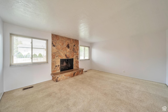 5373 S Clover Meadow Dr W, Murray, UT 84123 - unfurnished living room with carpet flooring and a fireplace