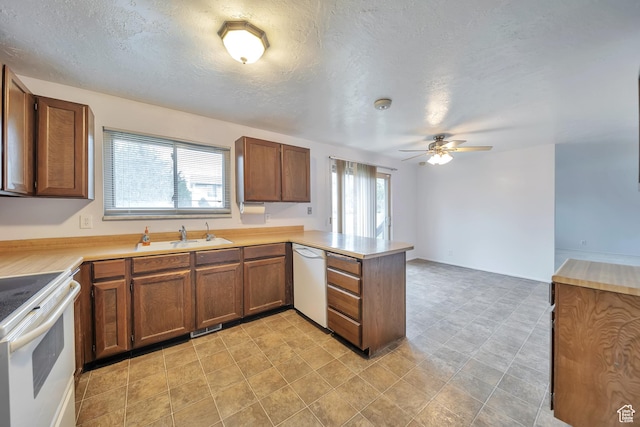 5373 S Clover Meadow Dr W, Murray, UT 84123 - kitchen featuring white appliances, a peninsula, a sink, a ceiling fan, and brown cabinetry