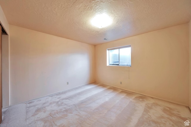 5373 S Clover Meadow Dr W, Murray, UT 84123 - empty room with a textured ceiling, light carpet, and baseboards