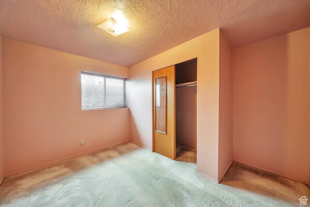 5373 S Clover Meadow Dr W, Murray, UT 84123 - unfurnished bedroom featuring carpet, a textured ceiling, a closet, and baseboards