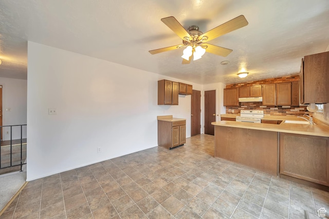 5373 S Clover Meadow Dr W, Murray, UT 84123 - kitchen with electric range, a sink, under cabinet range hood, a ceiling fan, and light countertops