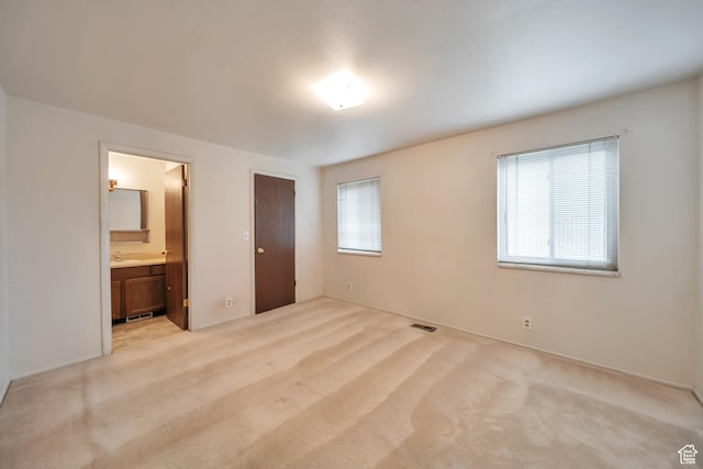 5373 S Clover Meadow Dr W, Murray, UT 84123 - unfurnished bedroom featuring light colored carpet, connected bathroom, and a sink