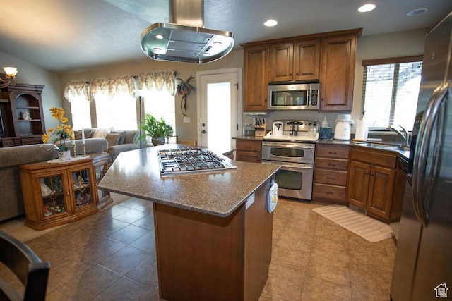 3234 N 550 W, Pleasant View, UT 84414 - kitchen with stainless steel appliances, a sink, brown cabinetry, open floor plan, and recessed lighting