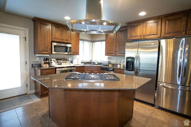 3234 N 550 W, Pleasant View, UT 84414 - kitchen with stainless steel appliances, island range hood, a sink, dark stone countertops, and recessed lighting