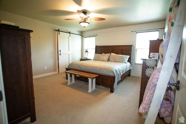 3234 N 550 W, Pleasant View, UT 84414 - bedroom featuring a barn door, carpet floors, a ceiling fan, and baseboards