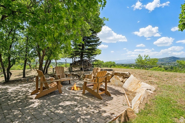 870 E Quail Hollow Cir, Alpine, UT 84004 - view of patio featuring a fire pit and a mountain view