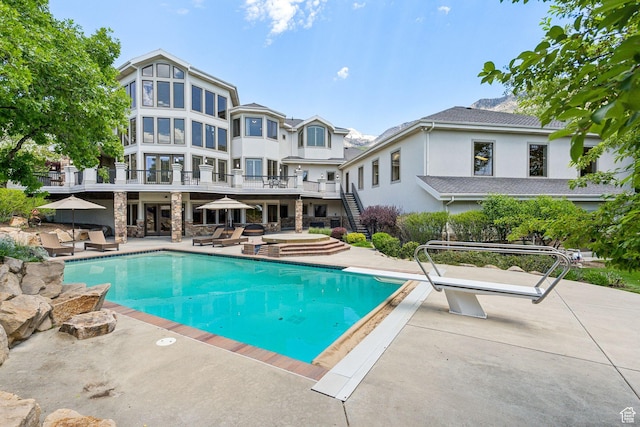 870 E Quail Hollow Cir, Alpine, UT 84004 - swimming pool with a patio, stairs, a diving board, and french doors
