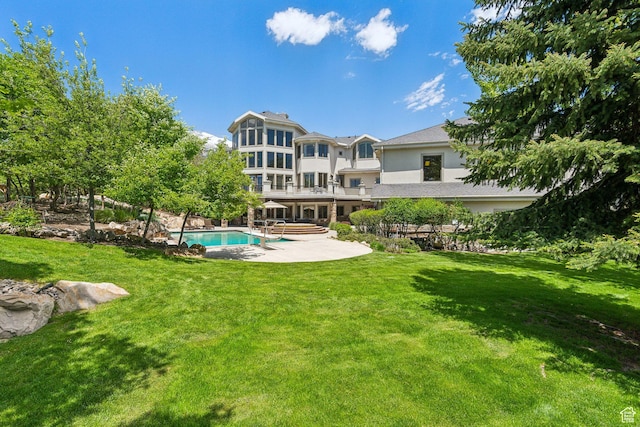 870 E Quail Hollow Cir, Alpine, UT 84004 - rear view of property featuring an outdoor pool, a patio area, and a lawn