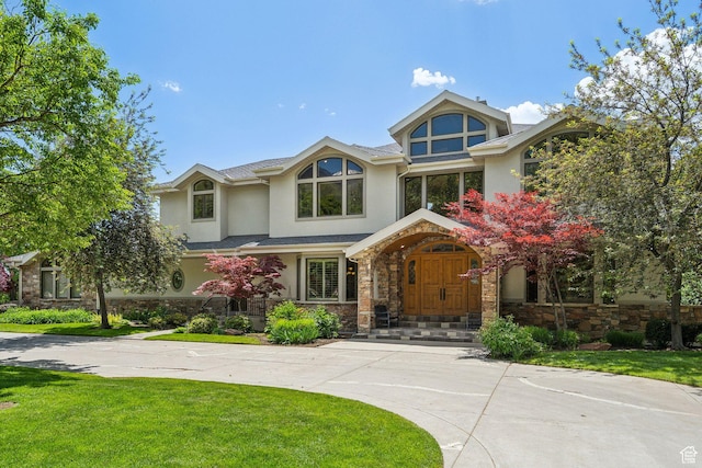 870 E Quail Hollow Cir, Alpine, UT 84004 - tudor-style house with stucco siding, stone siding, and a front lawn