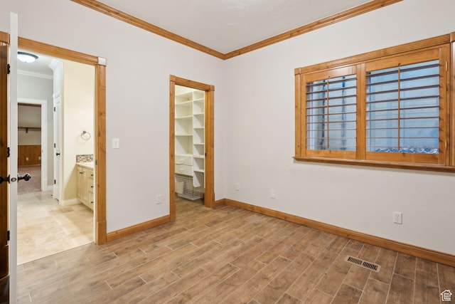 870 E Quail Hollow Cir, Alpine, UT 84004 - unfurnished bedroom featuring crown molding, baseboards, wood finished floors, a spacious closet, and a closet