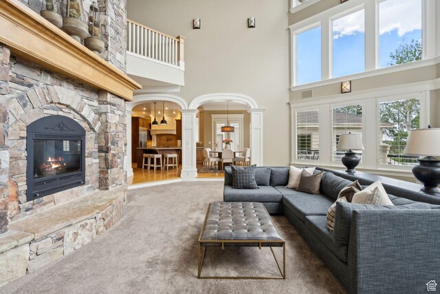 870 E Quail Hollow Cir, Alpine, UT 84004 - living area featuring a high ceiling, carpet flooring, decorative columns, a fireplace, and healthy amount of natural light