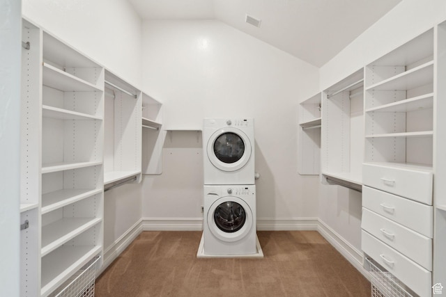 870 E Quail Hollow Cir, Alpine, UT 84004 - walk in closet featuring stacked washer / drying machine, carpet flooring, and lofted ceiling