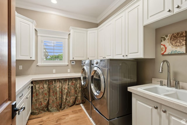 870 E Quail Hollow Cir, Alpine, UT 84004 - laundry area featuring cabinet space, washing machine and clothes dryer, ornamental molding, and light wood-type flooring