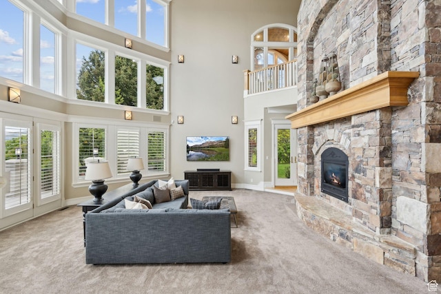 870 E Quail Hollow Cir, Alpine, UT 84004 - living room featuring a towering ceiling, carpet, a fireplace, and plenty of natural light