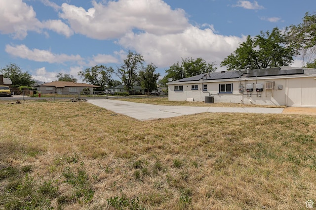 4815 W 4895 S, Kearns, UT 84118 - view of grassy yard with cooling unit and concrete driveway