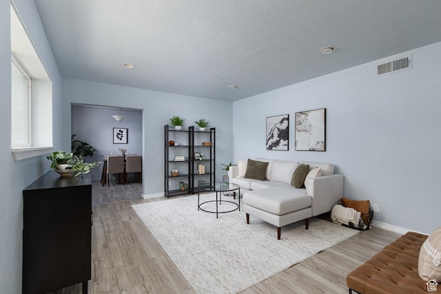 4815 W 4895 S, Kearns, UT 84118 - living area featuring light wood-style flooring and baseboards