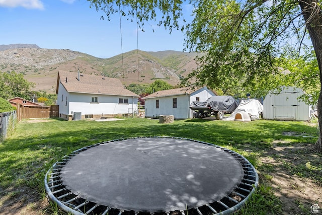 1250 E Center St, Springville, UT 84663 - view of yard with a trampoline, a mountain view, and central air condition unit