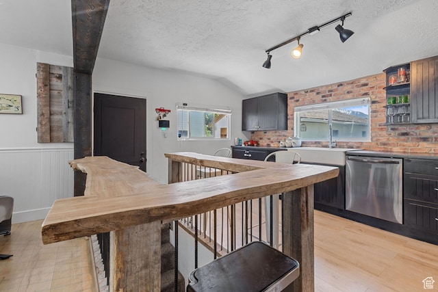 1250 E Center St, Springville, UT 84663 - kitchen with dishwasher, healthy amount of natural light, a wainscoted wall, a sink, and light wood-style flooring