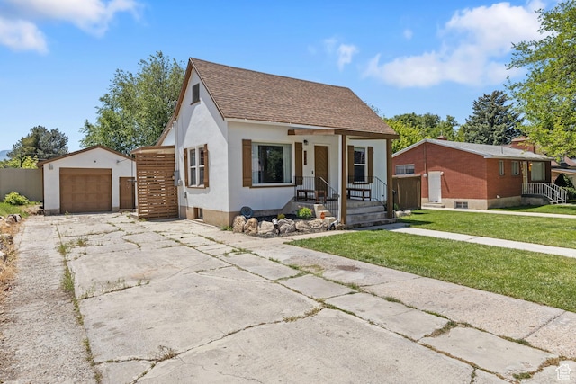 1250 E Center St, Springville, UT 84663 - view of front facade with an outbuilding, a porch, roof with shingles, stucco siding, and a front yard