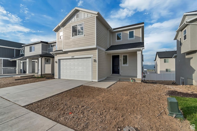 6737 S Glade Creek Dr W Unit 226, West Jordan, UT 84081 - view of front of house with an attached garage, concrete driveway, and a porch