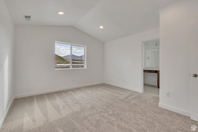 6737 S Glade Creek Dr W Unit 226, West Jordan, UT 84081 - spare room with light colored carpet, vaulted ceiling, and recessed lighting