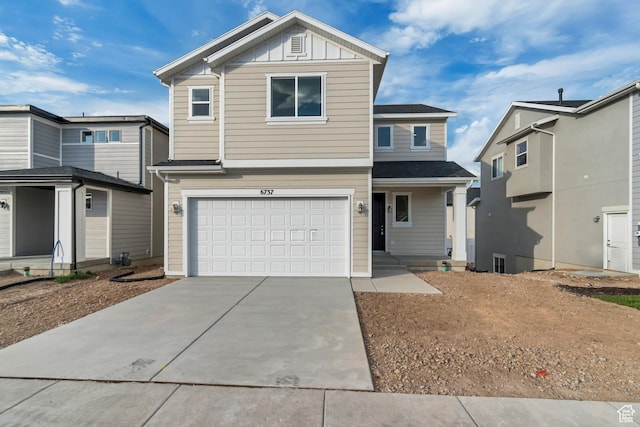 6737 S Glade Creek Dr W Unit 226, West Jordan, UT 84081 - view of front of property with an attached garage, driveway, and board and batten siding