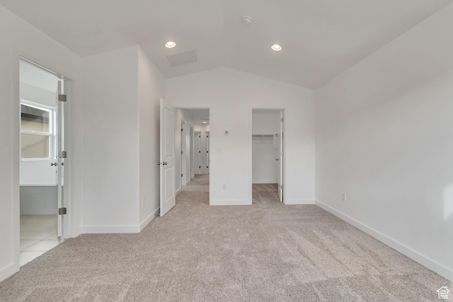 6737 S Glade Creek Dr W Unit 226, West Jordan, UT 84081 - unfurnished bedroom featuring light colored carpet, a spacious closet, vaulted ceiling, and a closet