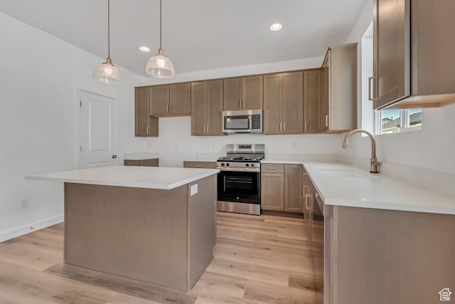 6737 S Glade Creek Dr W Unit 226, West Jordan, UT 84081 - kitchen featuring appliances with stainless steel finishes, light wood-style flooring, recessed lighting, a center island, and hanging light fixtures