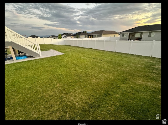 653 S 340 E, Smithfield, UT 84335 - view of yard featuring stairs, a patio area, and a residential view