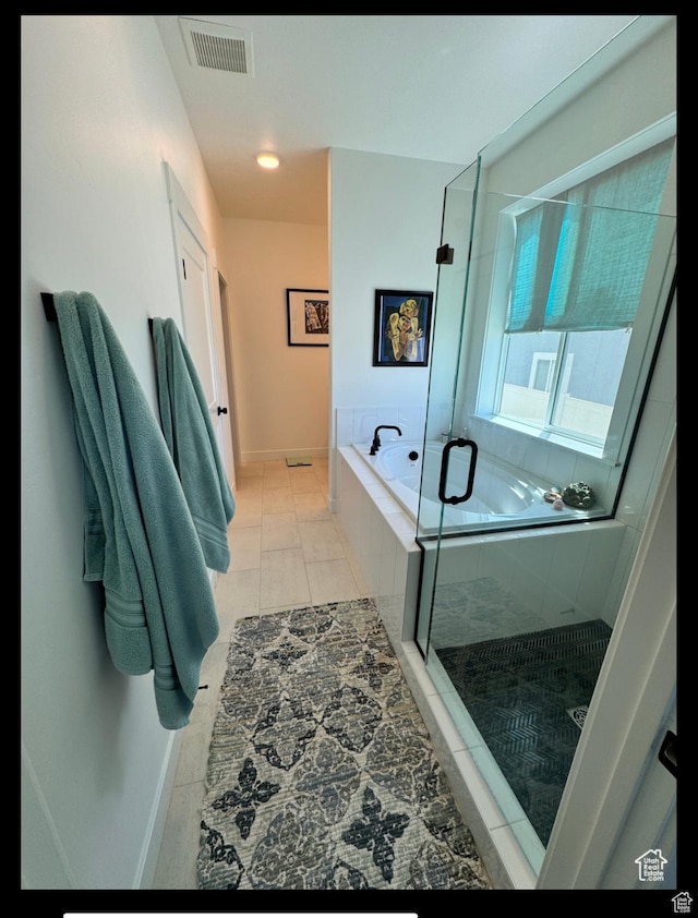 653 S 340 E, Smithfield, UT 84335 - bathroom featuring a bath, a stall shower, tile patterned floors, and baseboards